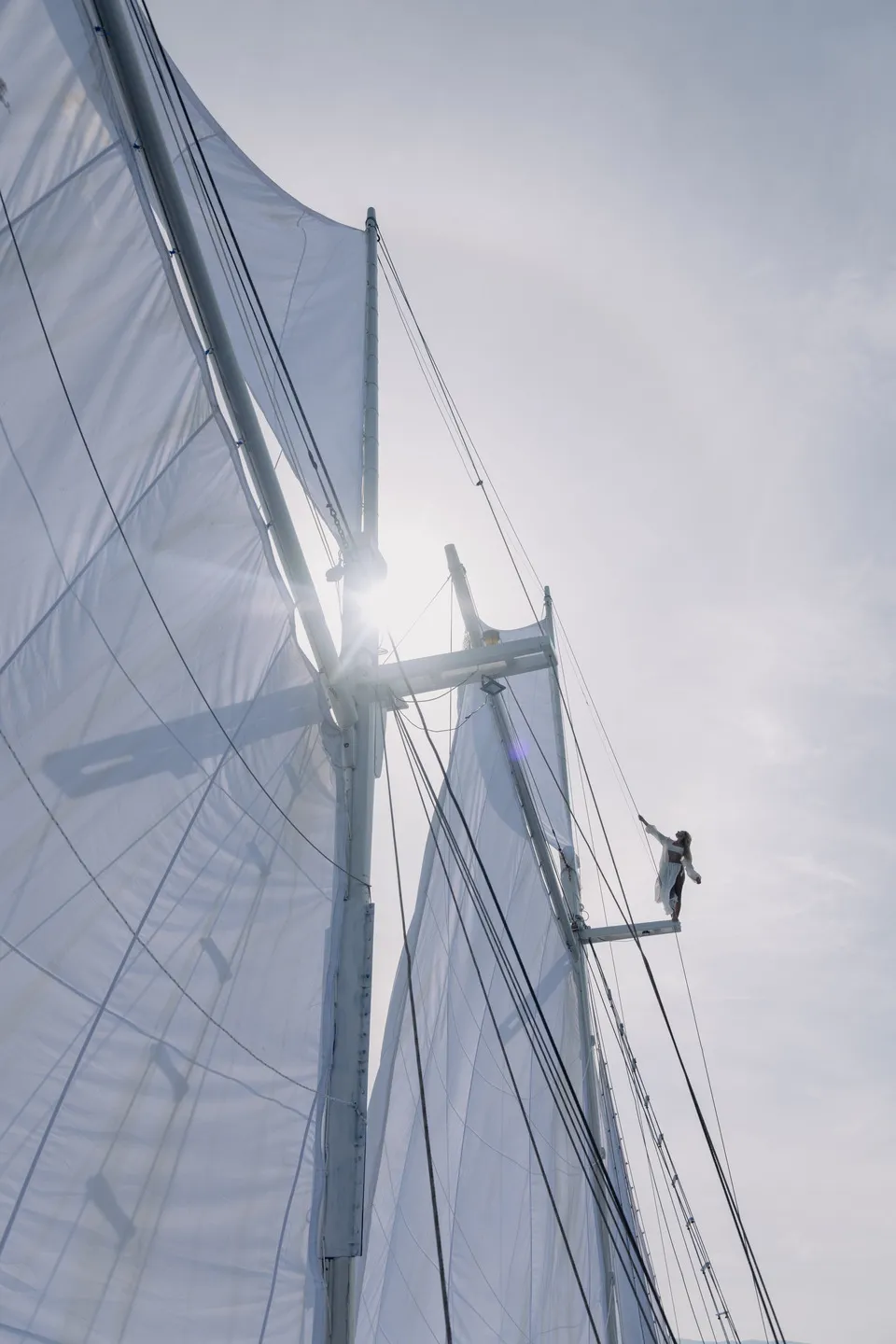Woman with white sails aboard Anne Bonny Liveaboard